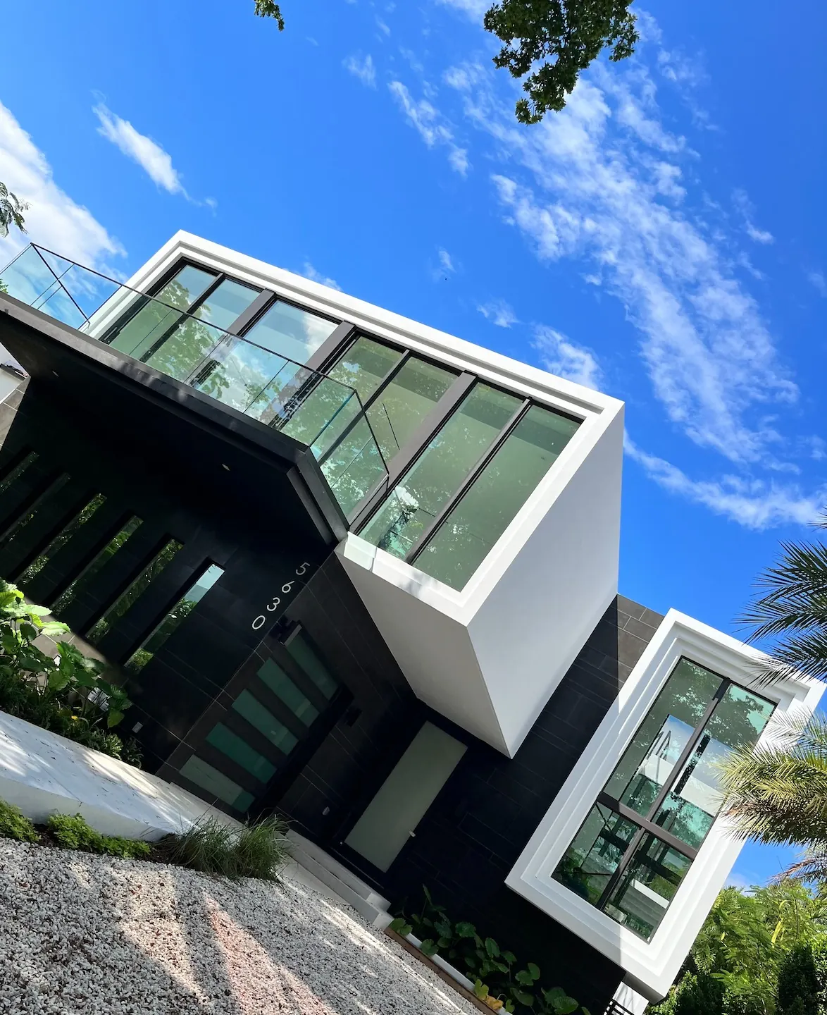 Modern Miami home with spotless glass and white exterior after Sparkleaners outdoor cleaning